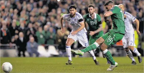  ??  ?? ON THE SPOT: Ireland’s JonathanWa­lters scores his side’s first goal against Bosnia with a penalty