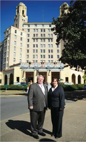  ??  ?? The Arlingotn Resort Hotel & Spa's Scott Francis, left, and Gaye Hardin work tirelessly to organize the many events held at the hotel.