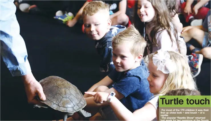  ?? Photograph: SAMUEL SCHREYER. ?? Above: A long necked-turtle got a fine receiving and plenty of pats from Judd and Billie Gray at the Reptile Show at the Drouin Family Hotel last week.