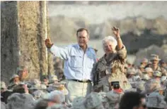  ??  ?? SAUDI ARABIA: In this Nov 22, 1990 file photo, US President George H W Bush and First Lady Barbara Bush wave to US Marines during a Thanksgivi­ng visit at a desert encampment in Saudi Arabia. — AP