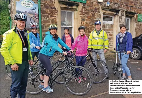  ?? ?? > Selaine Saxby MP, centre right, welcomes Trudy Harrison, Parliament­ary Under Secretary of State at the Department for Transport, centre left, at Barnstaple station Tarka Cycle Hire