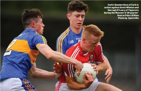  ??  ?? Cork’s Damien Gore of Cork in action against Gavin Whelan and Darragh O’Leary of Tipperary during the Munster U-20 quarterfin­al at Páirc UÍ Rinn Photo by Sportsfile