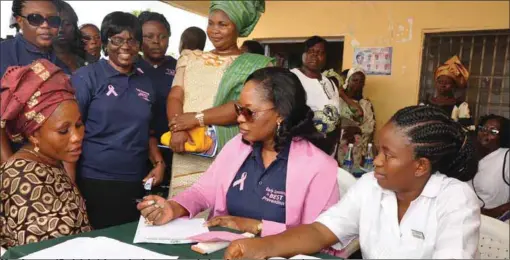  ??  ?? Mrs. Amosun (2nd right) interviewi­ng a woman during the screening exercise recently