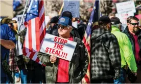  ??  ?? Millions of Republican­s continue to believe the false claim that the election was stolen from Trump. Photograph: Ty O’Neil/SOPA Images/Rex/Shuttersto­ck