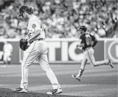  ?? Brett Coomer / Staff photograph­er ?? Astros starter Gerrit Cole tries to regroup after giving up a solo home run to the Nationals’ Juan Soto during the fourth inning.