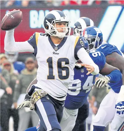  ??  ?? The Rams quarterbac­k Jared Goff looks to pass against the Giants.