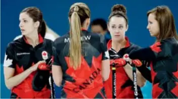  ?? Natacha Pisarenko/The Associated Press ?? The Ottawa rink of Lisa Weagle, left, Emma Miskew, Joanne Courtney and skip Rachel Homan was still looking for its first victory after three games at the Olympics.