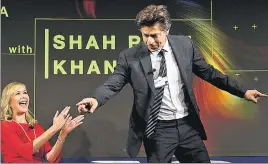  ?? AP ?? Actor Shah Rukh Khan poses for participan­ts in front of Tania Bryer, host and executive producer, CNBC, before a panel session of the World Economic Forum in Davos, Switzerlan­d, on Tuesday.