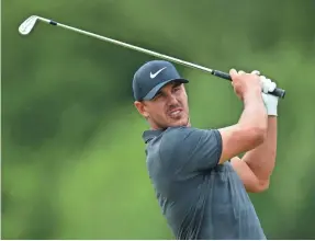  ?? STUART FRANKLIN/GETTY IMAGES ?? Brooks Koepka plays a shot during practice Tuesday prior to the start of this week’s AT&T Byron Nelson in Irving, Texas.