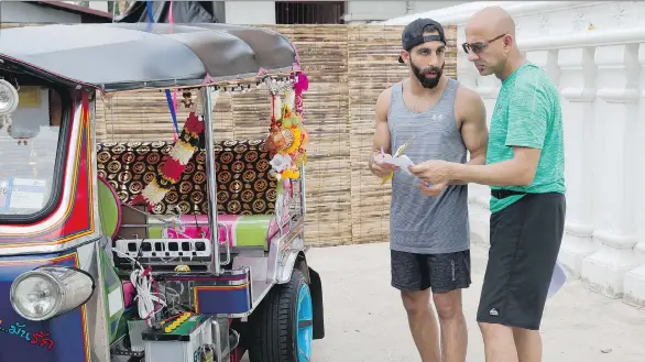  ??  ?? Shabbir and Zed Dhalla compete in the latest season of The Amazing Race Canada. The father and son made it midway through the competitio­n before being eliminated.