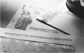  ?? ERIC GAY/AP 2020 ?? President Donald Trump’s name is seen on a stimulus check issued last spring by the IRS. Many are frustrated as a second payment has yet to arrive.