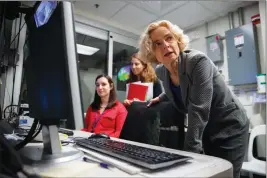  ?? ASSOCIATED PRESS ?? DR. NORA VOLKOW, DIRECTOR OF THE NATIONAL INSTITUTE ON DRUG ABUSE, works in the MRI lab at the National Institutes of Health’s research hospital in Bethesda, Md., on May 16. Volkow is studying how anti-addiction medicines work inside the brains of people undergoing treatment for opioid abuse. In the background are NIH neuroimagi­ng specialist­s Dana Feldman and Danielle Kroll.
IT’S A TOUGH SELL