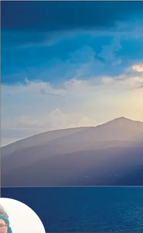  ??  ?? Above: Isle of Arran and Goatfell standing proud under the clouds and illuminate­d by the sunrays. Left: Fiona Russell on the summit