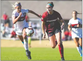  ?? SPECIAL TO NWA DEMOCRAT-GAZETTE/DAVID BEACH ?? Arkansas’ Anna Podojil (16) fights for the ball Sunday against Gerogia’s Hale Otto (19) at Razorback Field in Fayettevil­le.