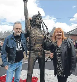  ?? Picture: Kim Cessford. ?? Former AC/DC bassist Mark Evans and Mary Renshaw at the unveiling of Bon Scott’s statue in 2016. Mark will be back in Kirriemuir this summer to re-enact one of the band’s famous videos on the back of a lorry.