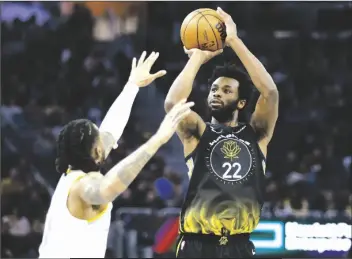  ?? JED JACOBSOHN/AP ?? GOLDEN STATE WARRIORS FORWARD ANDREW WIGGINS (22) shoots against Los Angeles Lakers guard D’angelo Russell (1) during the first half of game in San Francisco on Saturday.