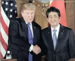  ??  ?? US President Donald Trump shakes hands with Japanese Prime Minister Shinzo Abe during a joint news conference at the Akasaka Palace in Tokyo yesterday. Trump is on a five-country trip through Asia, travelling to Japan, South Korea, China, Vietnam and...