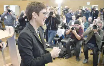  ?? — AFP ?? Annegret Kramp-karrenbaue­r leaves after delivering a press conference on her candidacy to lead the CDU party in Berlin.