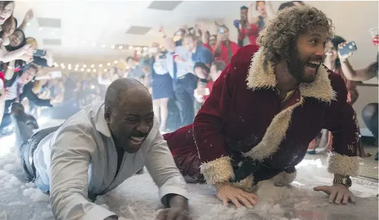  ??  ?? Courtney B. Vance and T.J. Miller in a scene from the comedy The Office Christmas Party, which hits theatres Friday.