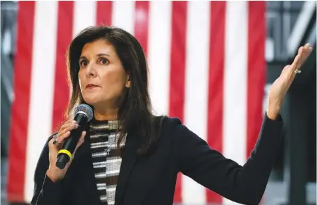  ?? AP PHOTO/CHARLIE NEIBERGALL ?? Republican presidenti­al candidate Nikki Haley speaks to voters at a town hall campaign event Monday in Urbandale, Iowa.