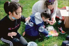  ?? Yehyun Kim / CTMirror.org ?? hesia Mejia, 8, left, blows bubbles during a protest to expand HUSKY Health to all immigrants in Connecticu­t this year, starting with those under 18. As an undocument­ed minor, Shesia will be eligible for HUSKY Health Program beginning Jan. 1, 2023, but with the current system, she will lose the eligibilit­y in a few months when she turns nine.