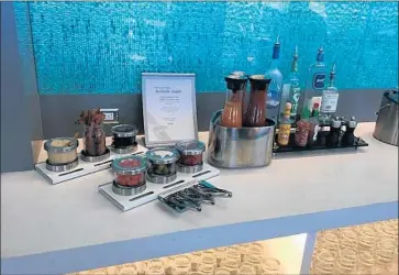  ?? Hugo Martin Los Angeles Times ?? AMERICAN AIRLINES f liers with access to the new Flagship Lounge at LAX can make Bloody Mary drinks — crispy strips of bacon included. And super-elite passengers are treated to sit-down meals at a restaurant.