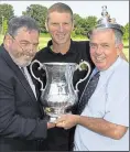  ??  ?? Jim Ward back in 2002 with the FA Cup, Stones chairman Paul BowdenBrow­n and Steve Butler