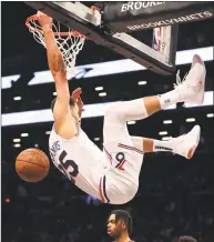  ?? Elsa / Getty Images ?? The 76ers’ Ben Simmons dunks in the fourth quarter against the Nets during Thursday’s Game 3.
