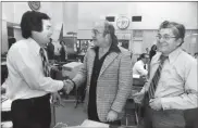  ?? Bob Fila/Chicago tribune/tns, File ?? A 1978 photograph captured “Lou Grant” star Ed Asner’s visit to the Chicago Tribune newsroom. Pictured with Asner, center: City Editor Bernie Judge (left) and Day City Editor Donald Agrella (right).
