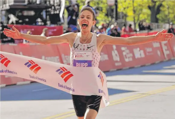  ?? | PAUL BEATY/ AP ?? Galen Rupp ( above) became the first American to win the men’s Bank of America Chicago Marathon since Khalid Khannouchi in 2002. Rupp’s time was 2: 09: 20.