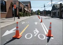  ?? RICHARD SNYDER PHOTO ?? During the piolet test, Henry Street is transforme­d from a two-way street into a one-way street with a two-way cycle track on one side of the road and dedicated street parking on the opposite side of the road.