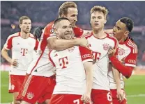  ?? ?? HEADS WE WIN Delighted Bayern stars hail Kimmich after goal