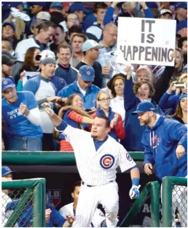  ?? | GETTY IMAGES ?? Kyle Schwarber takes a curtain call after hitting a home run that landed on top of the right- field video board atWrigley Field during the 2015 NL Division Series.