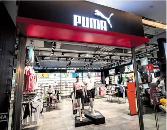  ??  ?? A Puma outlet in Shanghai is seen in this file photo. The German sportswear company believes global growth in running should help to support a strong improvemen­t after the second quarter. — IC