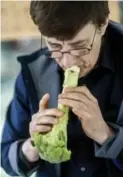  ??  ?? Orchestra founder Dale Stuckenbru­ck plays a broccoli flute.