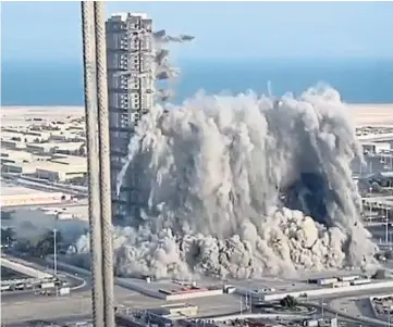  ??  ?? DEMOLITION: The Meena Plaza was reduced from four towers to rubble in 10 seconds.