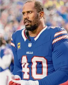  ?? Jeff Lewis/associated Press ?? Buffalo Bills linebacker Von Miller (40) stands for the National Anthem before playing the Dallas Cowboys on Dec. 17 in Orchard Park, NY. Miller calls the domestic violence allegation­s against him “100 percent false.”