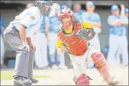  ?? File photo ?? Rocky Hill, Cromwell and Portland catcher Kevin Radziewicz chases down a wild pitch by Jake Regula in the bottom of the seventh inning, allowing Middletown Post 75 center fielder Anthony Marino to score the tying run in the American Legion's Norm Way...