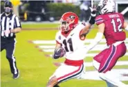  ?? AP FILE PHOTO/SEAN RAYFORD ?? Arian Smith (11) became the latest Georgia wide receiver injured this spring, but coach Kirby Smart was not overly concerned after the sophomore sprained his wrist during the Bulldogs’ scrimmage Saturday.