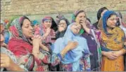  ?? WASEEM ANDRABI/HT PHOTO ?? ▪ Family of Nazir Ahmad, one of the NC workers shot dead, mourns at his funeral procession in Srinagar on Friday.