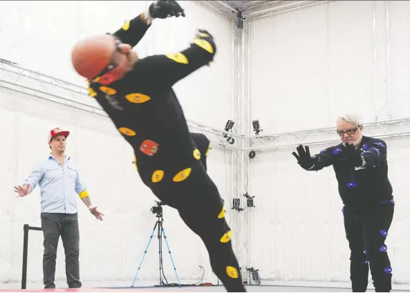  ?? PHOTOS: GERRY KAHRMANN ?? Christophe­r Ian Bennett, left, directs Max Harvey, centre, and Stuart Derdeyn in a video game to demonstrat­e how the technology works at Beyond Capture motion-capture studio.