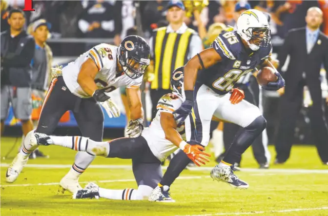  ??  ?? SAN DIEGO: San Diego Chargers tight end Antonio Gates (85) runs as Chicago Bears cornerback Kyle Fuller (23) and outside linebacker Jonathan Anderson (58) defend during the second half of an NFL football game Monday, in San Diego.