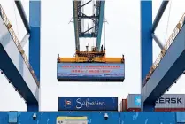  ?? ?? A container to be delivered to the Port of Mombasa, Kenya, is being loaded to a ship at the Port of Guangzhou, south China’s Guangdong Province, on 7 October 2021