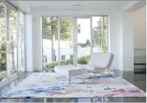  ?? JANIS NICOLAY ?? Vancouver artist Zoe Pawlak, who designs rugs in collaborat­ion with Burritt Bros., introduces splashes of colour to floor coverings.