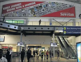  ?? PHOTO: JOHNNY ONVERWACHT ?? Pictures of your favourite read, Sowetan, take centre stage at the bustling Park Station in Johannesbu­rg