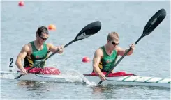  ?? PAUL CHIASSON/ THE CANADIAN PRESS ?? Saskatchew­an’s Mykel Kowaluk and Jarret Kenke paddle to a gold in the men’s 1000m K2 race at the Canada Games Monday.