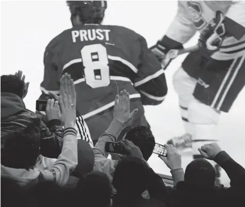  ?? ALLEN MCINNIS/ THE GAZETTE ?? Fans bang on the glass as Canadiens right wing Brandon Prust skates by during an inter-squad game at the Bell Centre last week.