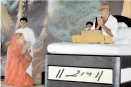  ?? — PTI ?? Rajasthan chief minister Vasundhara Raje seeks blessings of Morari Bapu at a “Ram Katha” in Kaman, near Bharatpur, on Sunday.