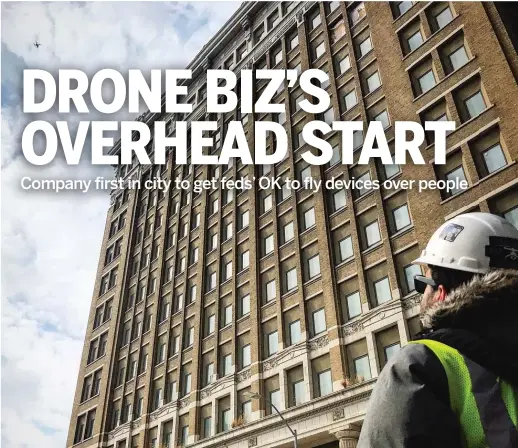  ?? PROVIDED PHOTO ?? Helios Visions co-founder and chief pilot Tyler Gibson operates a drone outside the former Cook County Hospital building.