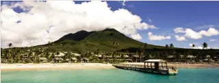  ??  ?? Head in the clouds: The verdant, sunkissed Caribbean island of Nevis